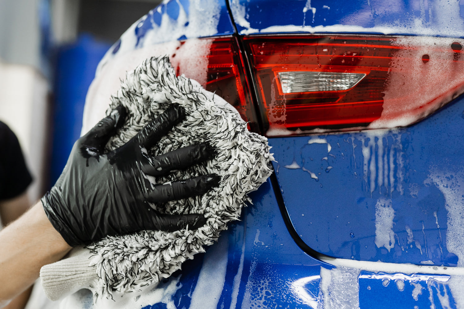 Professional washing a vehicle